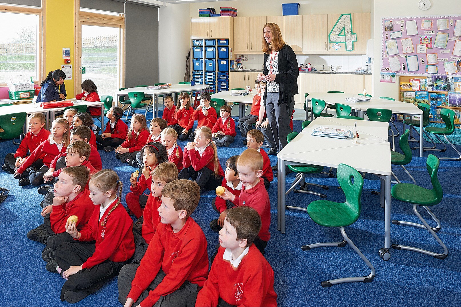 Pupils and their teacher using flexible VS furniture in the first UK school project completed by Henning Madsen