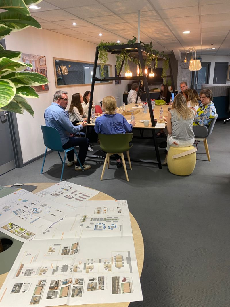 School project team discussing furniture layouts and learning space plans